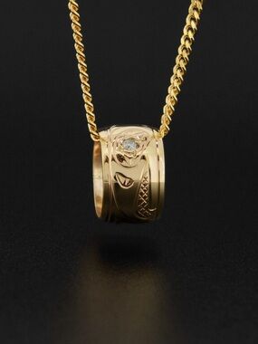 Solid 14K gold northwest native totem bead with diamond